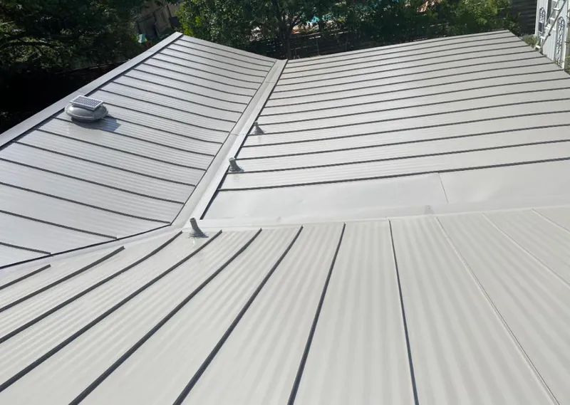 Solar attic fan installed on a metal roof for Roof Ventilation in Potomac Park