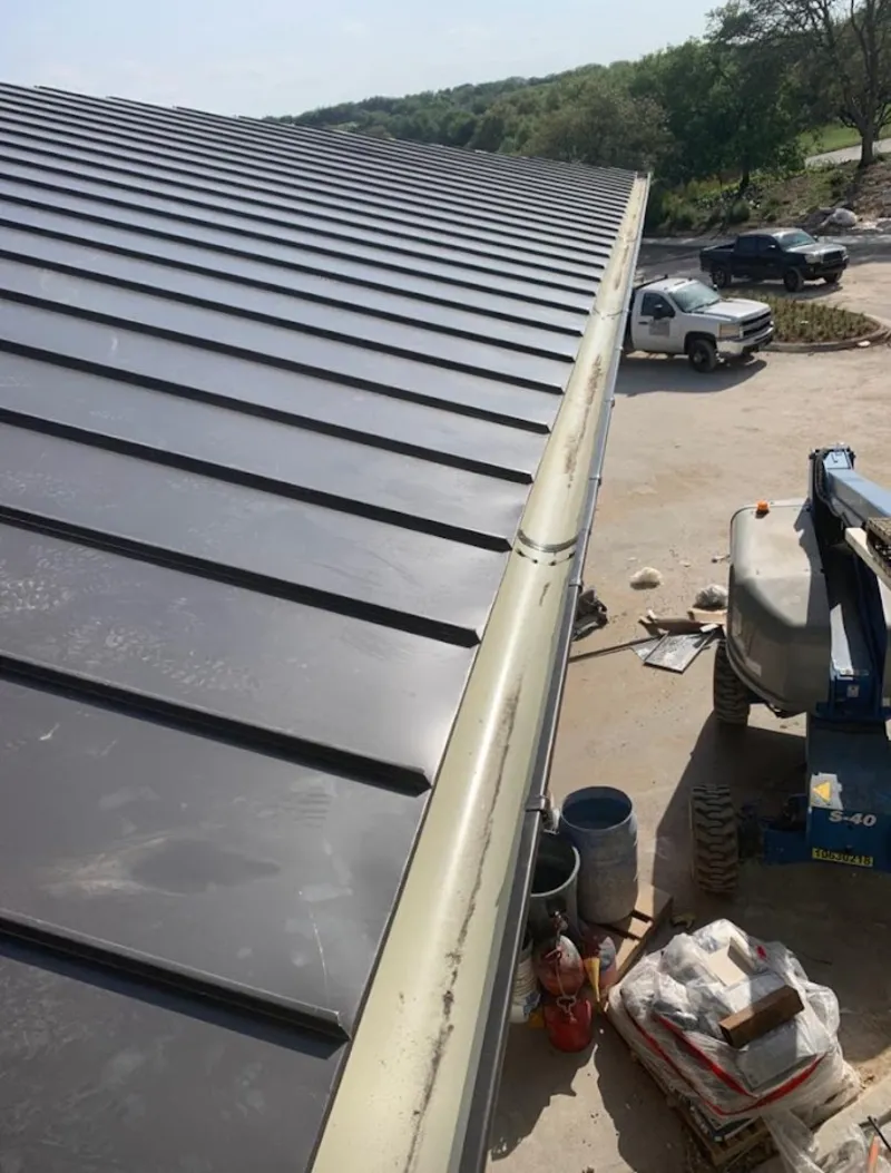 Standing seam panel and gutter detail on a metal roofing jobsite in Potomac Park